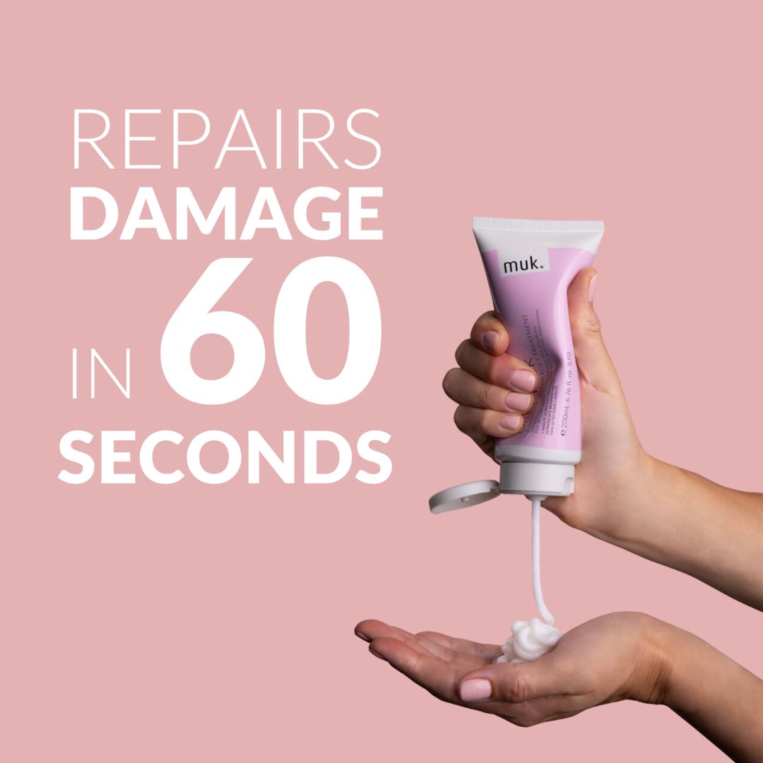 Hand holding a pink muk hair product with text 'Repairs damage in 60 seconds' on a pink background