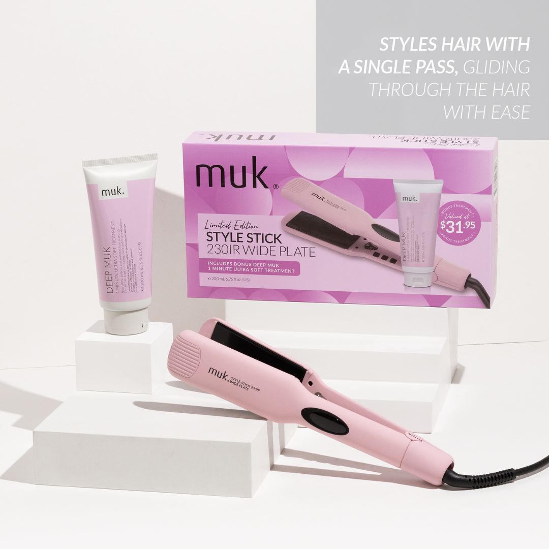 Pink hair straightener with 'muk' branding on a white background