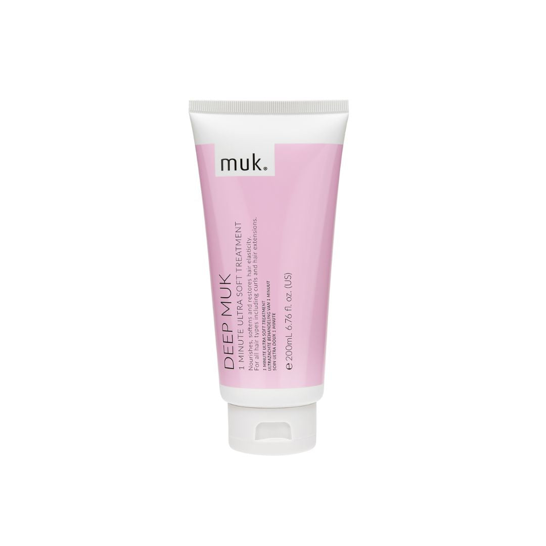 A squeeze tube of muk. Deep Muk Luminous Ultra Soft Treatment on a solid white background.