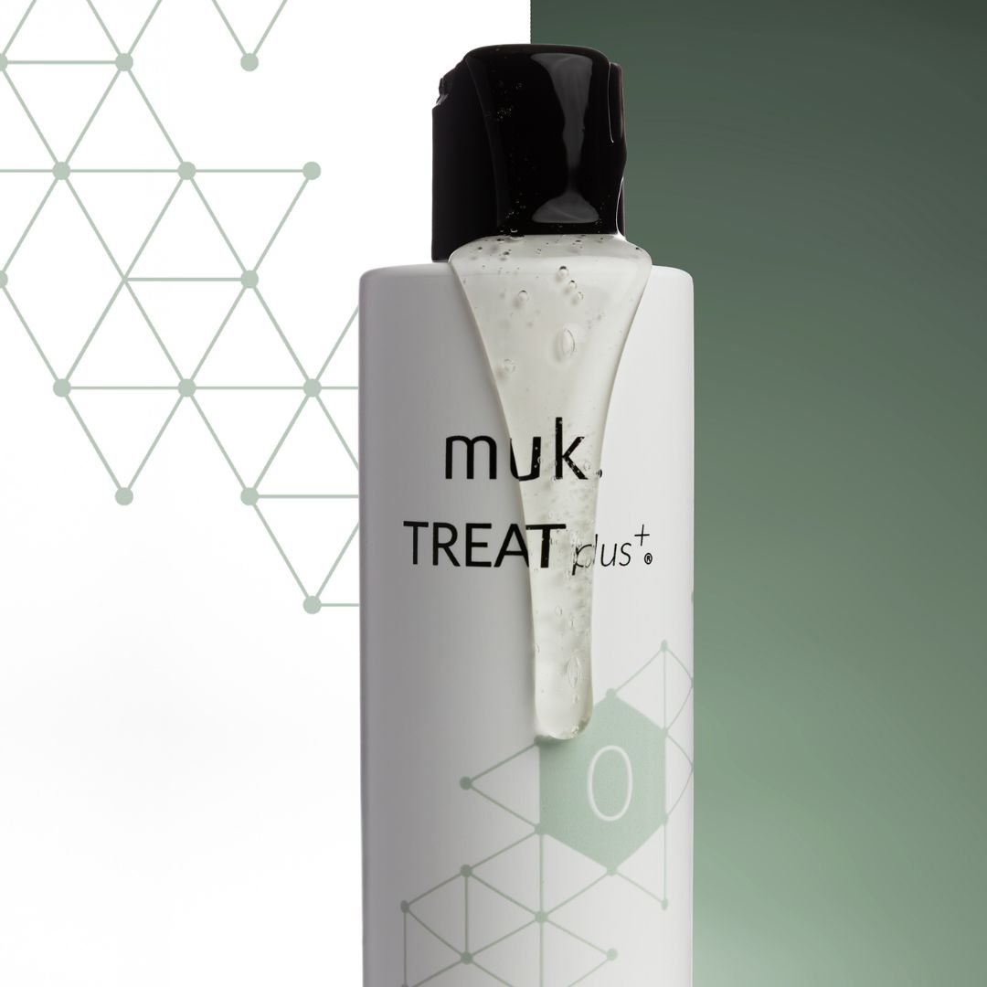 muk treat plus bottle on a gradient background